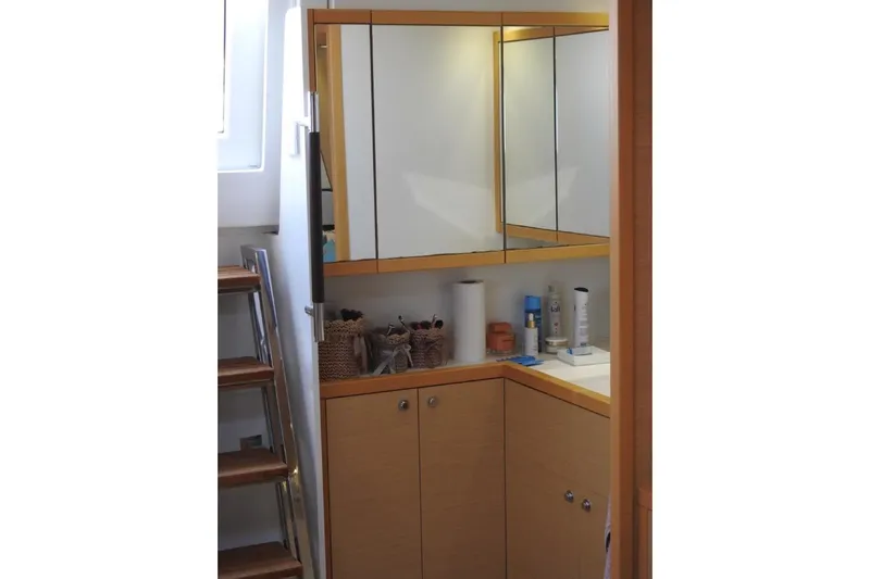  Yacht Photos Pics Bathroom vanity area in 2014 Lagoon 560 S2 yacht with mirrored cabinets.