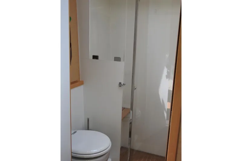  Yacht Photos Pics Bathroom interior of 2014 Lagoon 560 S2 yacht, featuring modern shower and toilet.