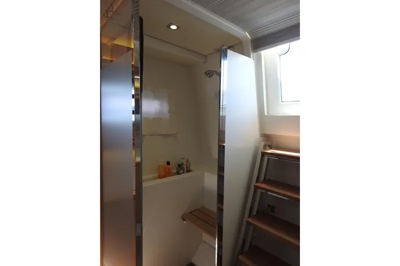  Yacht Photos Pics Bathroom interior of 2014 Lagoon 560 S2 yacht with shower and wooden steps.