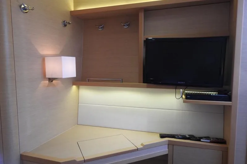  Yacht Photos Pics Modern interior of 2014 Lagoon 560 S2 yacht with TV and ambient lighting.