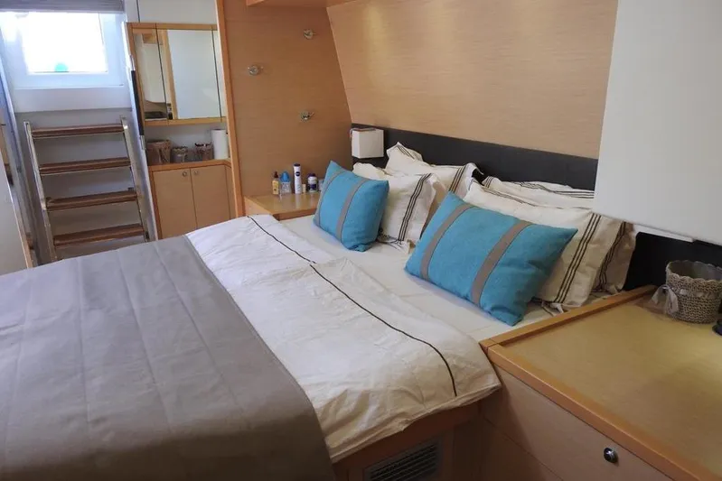  Yacht Photos Pics Luxurious bedroom interior of 2014 Lagoon 560 S2 yacht with modern decor.