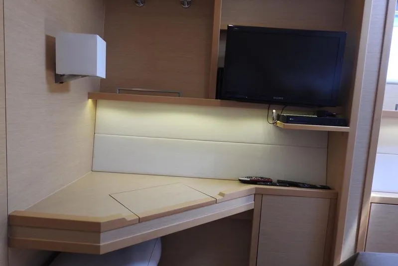  Yacht Photos Pics Interior of 2014 Lagoon 560 S2 yacht with TV and modern desk area.