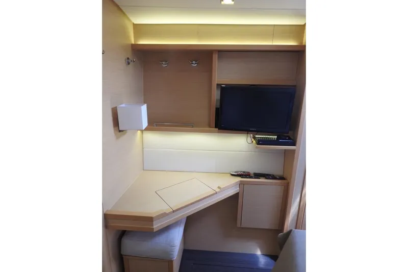  Yacht Photos Pics Modern interior of 2014 Lagoon 560 S2 yacht with TV and desk area.
