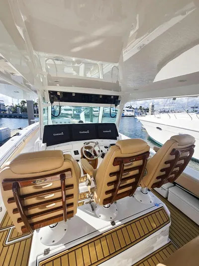 Hcb Yacht Photos Pics 2023 HCB Suenos boat interior with three tan seats and a modern dashboard.