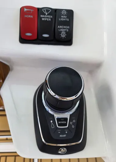 Hcb Yacht Photos Pics 2023 HCB Suenos boat control panel with joystick and switches for horn, wiper, and lights.