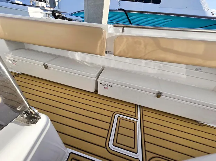 Hcb Yacht Photos Pics 2023 HCB Suenos boat interior with cushioned seating and teak-style flooring.