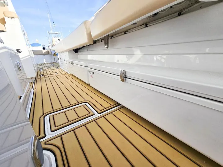 Hcb Yacht Photos Pics 2023 HCB Suenos boat deck with sleek, modern design and wood-like flooring.