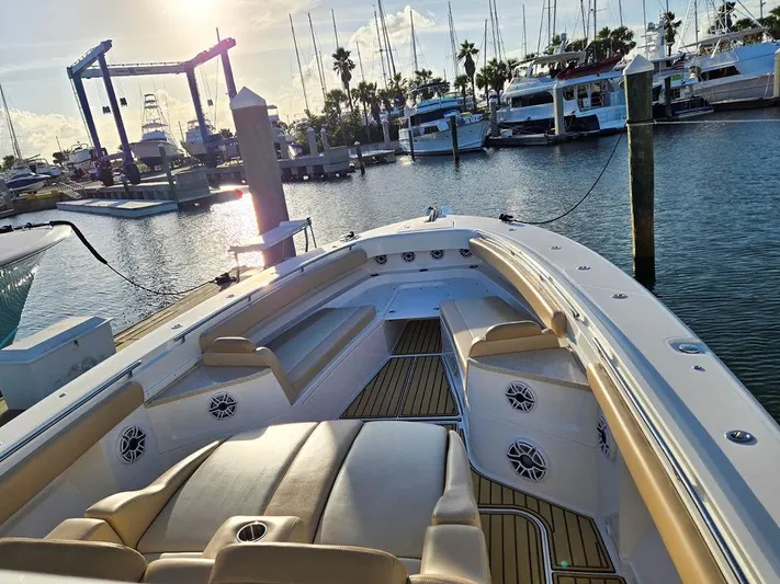 Hcb Yacht Photos Pics 2023 HCB Suenos boat docked at marina, featuring spacious seating and elegant design.