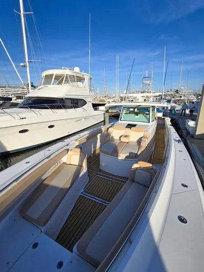 Hcb Yacht Photos Pics 2023 HCB Suenos luxury yacht docked in marina, featuring spacious deck and elegant design.