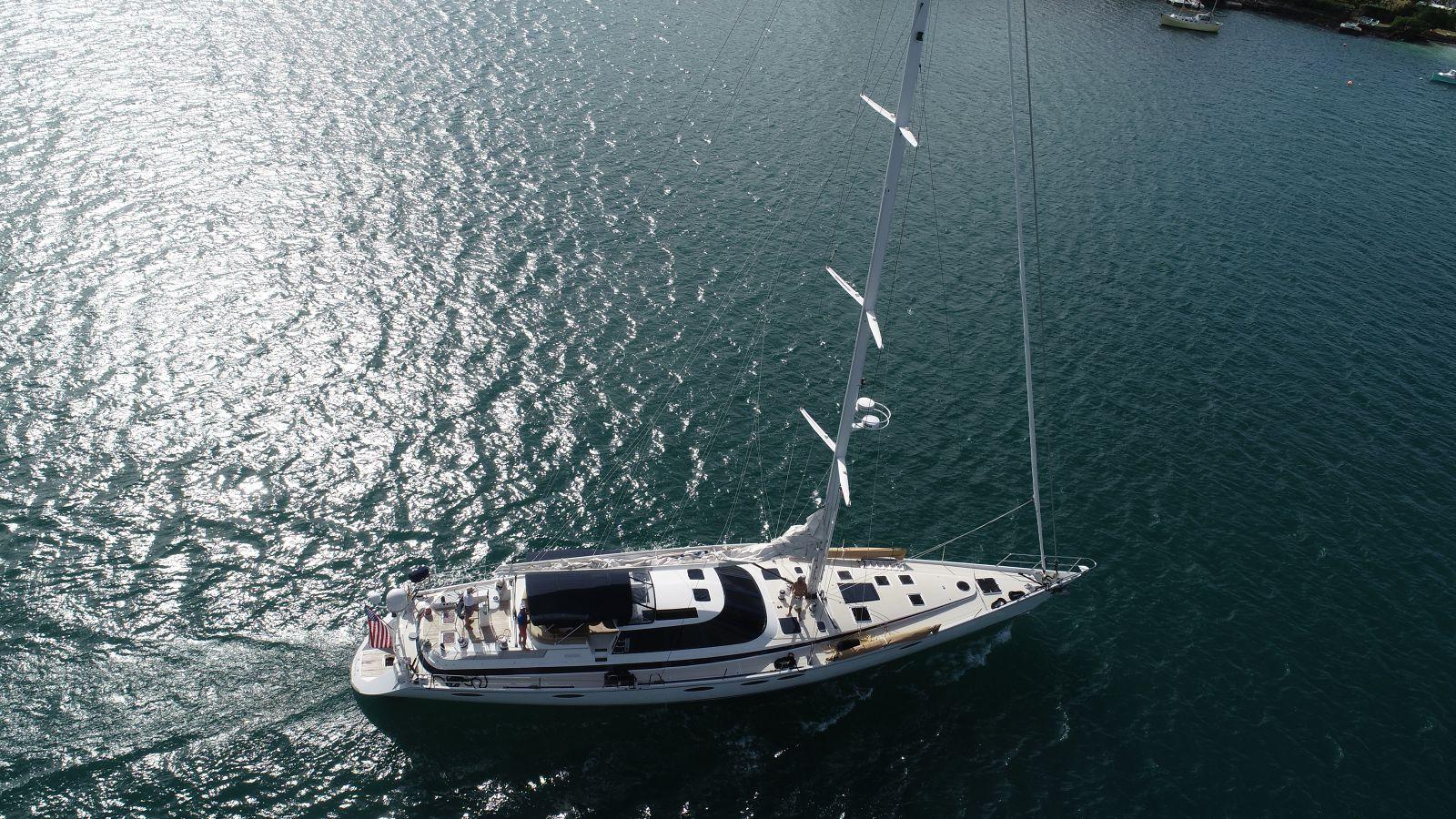 Aerial view of 1993 Able Custom 97' yacht sailing on shimmering water.