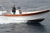 2023 Gozzo Positano 27 Open boat cruising on the water.