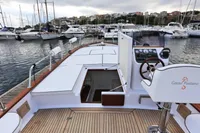 2023 Gozzo Positano 27 Open boat docked in a marina, showcasing elegant design.