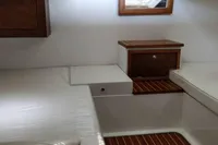 Interior of 2023 Gozzo Positano 27 Open boat with wooden accents and seating.