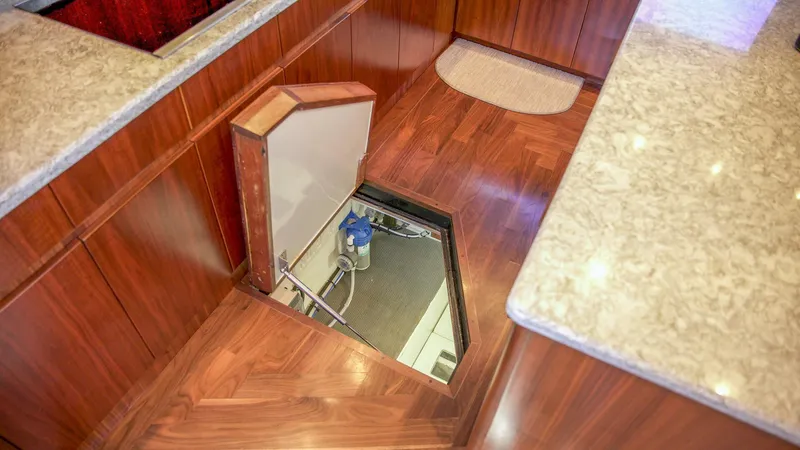 Emma Ruth Yacht Photos Pics Engine room access hatch on 1991 Monterey 65 Convertible Custom Sportfish yacht.