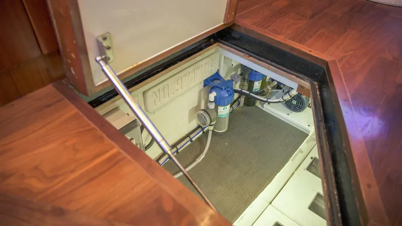 Emma Ruth Yacht Photos Pics Engine room access hatch on 1991 Monterey 65 Convertible Custom Sportfish boat.