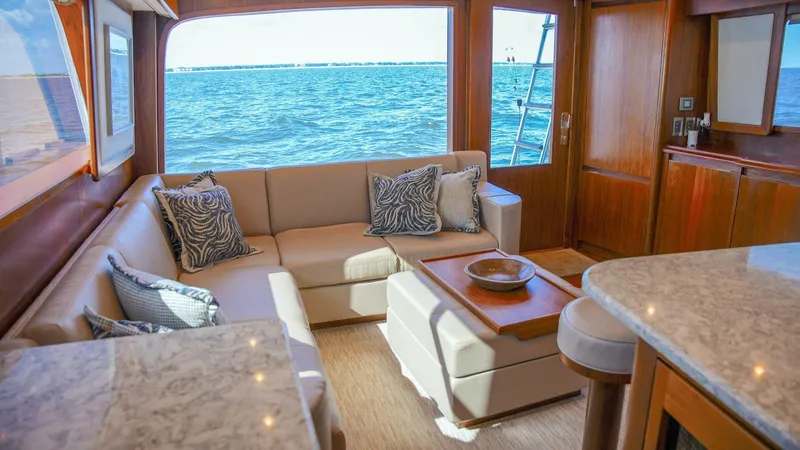 Emma Ruth Yacht Photos Pics Luxurious interior of 1991 Monterey 65 Convertible Custom Sportfish yacht with ocean view.