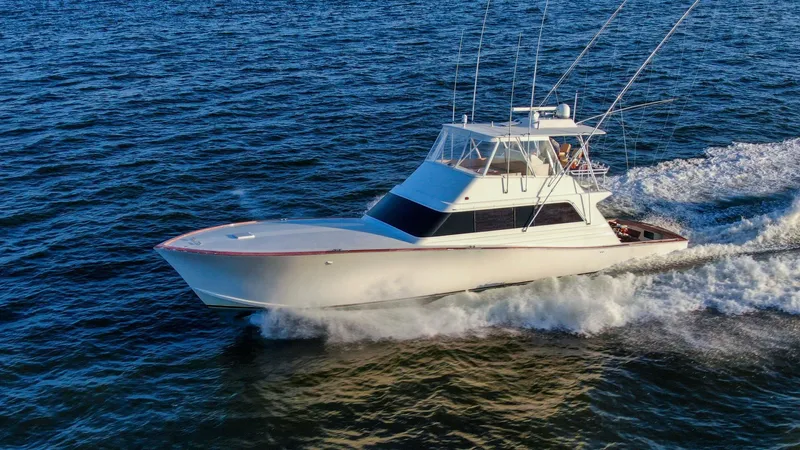 Emma Ruth Yacht Photos Pics 1991 Monterey 65 Convertible Custom Sportfish cruising on open water.
