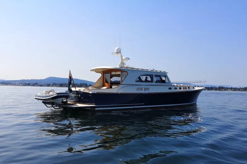 Ripplecove Yacht Photos Pics 2006 Vicem 54 Classic yacht on calm water, clear sky background.