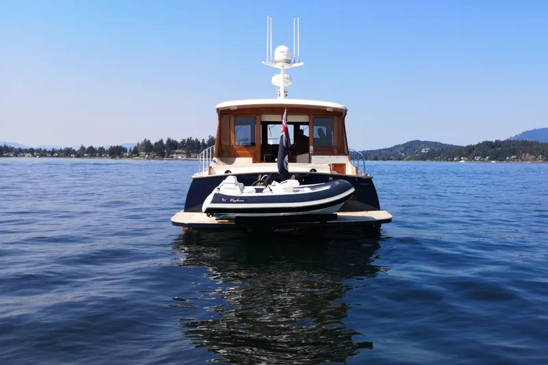 Ripplecove Yacht Photos Pics 2006 Vicem 54 Classic yacht on calm water with scenic background.