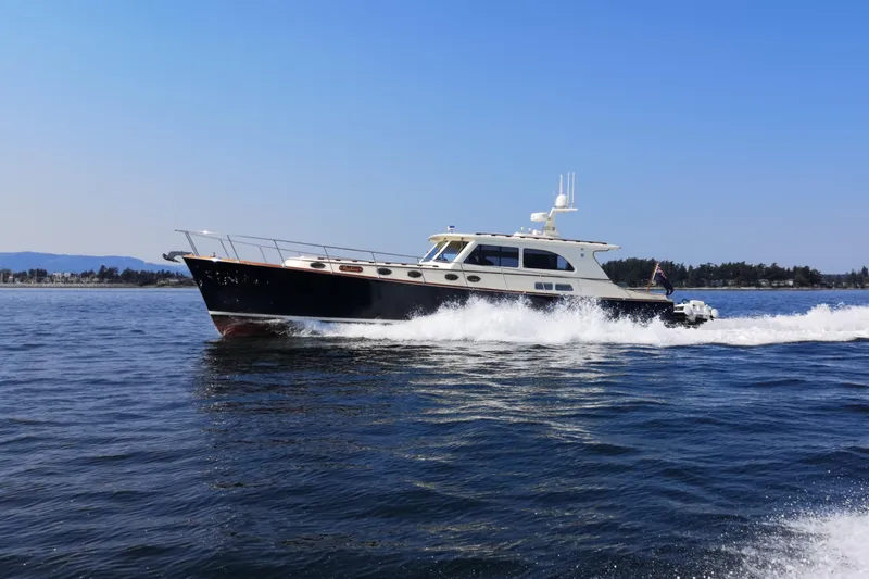 Ripplecove Yacht Photos Pics 2006 Vicem 54 Classic yacht cruising on open water under clear blue sky.