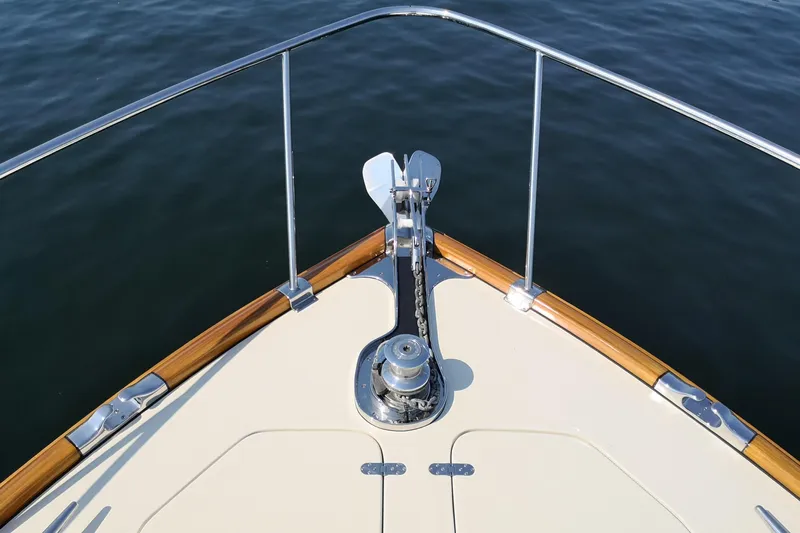 Ripplecove Yacht Photos Pics Bow of 2006 Vicem 54 Classic yacht with anchor and railing over water.