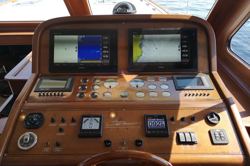 Ripplecove Yacht Photos Pics Control panel of a 2006 Vicem 54 Classic yacht with navigation screens and gauges.
