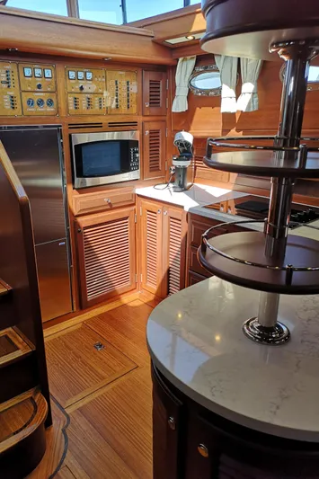 Ripplecove Yacht Photos Pics Interior of 2006 Vicem 54 Classic yacht with wood finishes and modern kitchen amenities.