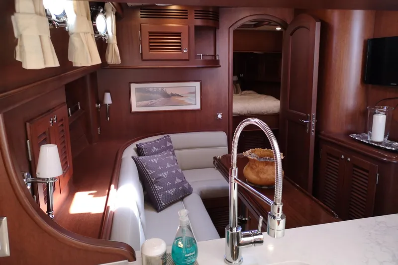 Ripplecove Yacht Photos Pics Luxurious 2006 Vicem 54 Classic yacht interior with elegant wood finish and cozy seating area.