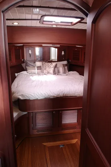 Ripplecove Yacht Photos Pics Luxurious cabin interior of 2006 Vicem 54 Classic yacht with elegant wood finish.