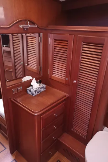 Ripplecove Yacht Photos Pics Luxurious wooden interior of 2006 Vicem 54 Classic yacht with cabinets and mirror.