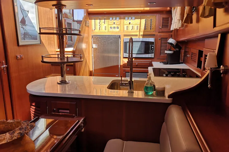 Ripplecove Yacht Photos Pics Luxurious 2006 Vicem 54 Classic yacht kitchen with modern amenities and elegant wood finishes.