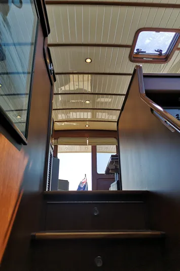 Ripplecove Yacht Photos Pics Interior view of 2006 Vicem 54 Classic yacht, showcasing wooden stairs and ceiling details.