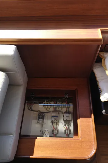 Ripplecove Yacht Photos Pics Electrical panel under glass on 2006 Vicem 54 Classic yacht with wooden interior.
