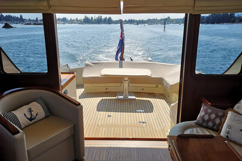 Ripplecove Yacht Photos Pics Interior view of 2006 Vicem 54 Classic yacht with elegant seating and ocean backdrop.
