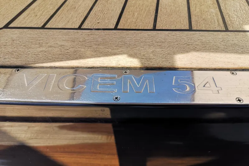 Ripplecove Yacht Photos Pics Vicem 54 Classic 2006 yacht nameplate on wooden deck.