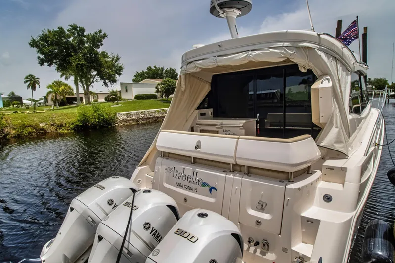  Yacht Photos Pics 2020 Regal 38 XO yacht docked with Yamaha outboard engines, scenic waterfront view.