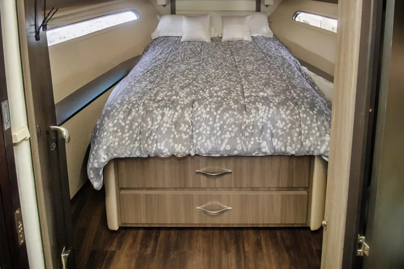  Yacht Photos Pics Cozy bedroom in 2020 Regal 38 XO yacht with modern bedding and wood accents.