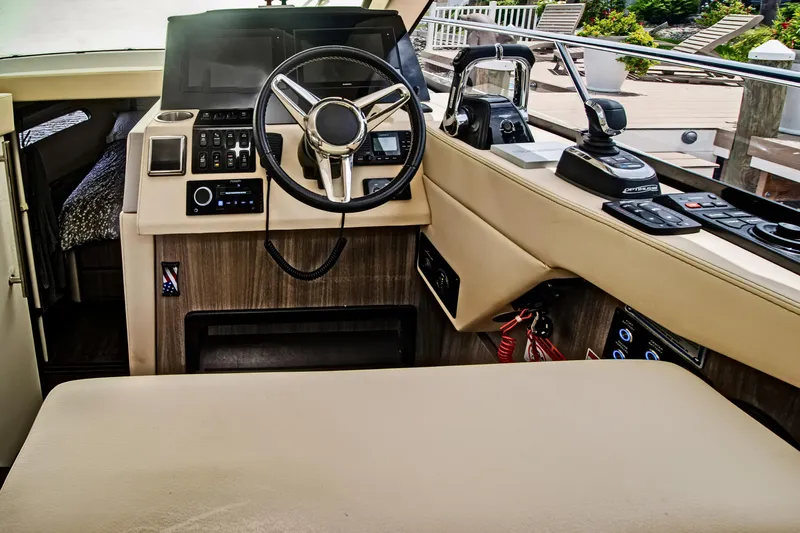  Yacht Photos Pics 2020 Regal 38 XO yacht helm with modern controls and luxurious interior.