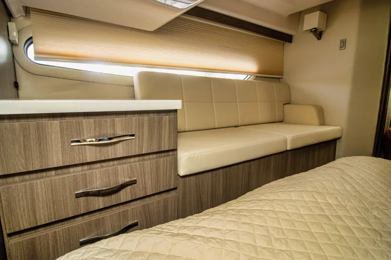  Yacht Photos Pics Luxurious interior of 2020 Regal 38 XO yacht with beige seating and wood cabinetry.