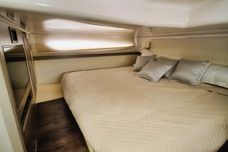  Yacht Photos Pics Luxurious cabin interior of 2020 Regal 38 XO yacht with cozy bedding.