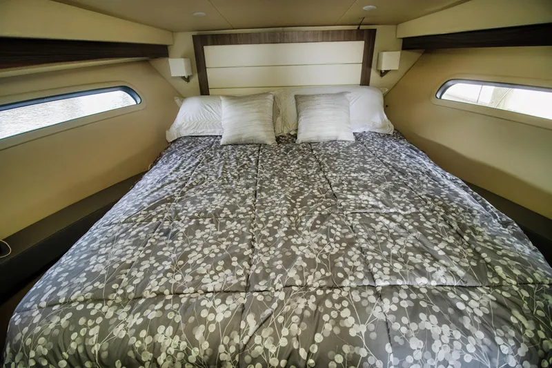  Yacht Photos Pics Luxurious bedroom interior of 2020 Regal 38 XO yacht with floral bedding.