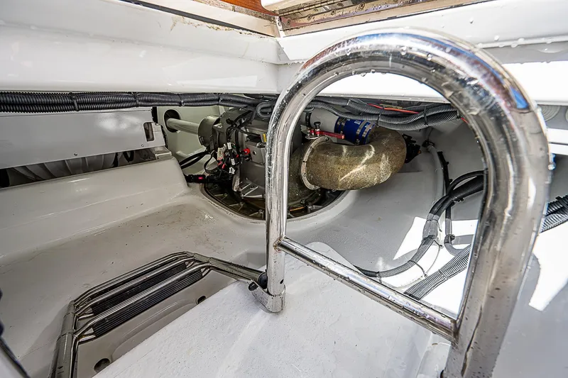Lucky Yacht Photos Pics Engine compartment of 2022 Maverick 50 Sport Yacht, showcasing mechanical components and wiring.
