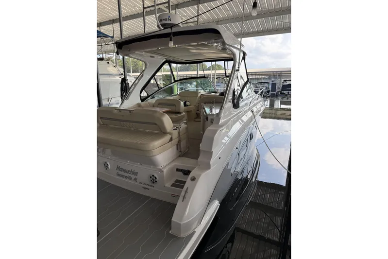  Yacht Photos Pics 2020 Regal 33 Express boat docked, featuring sleek design and spacious seating.