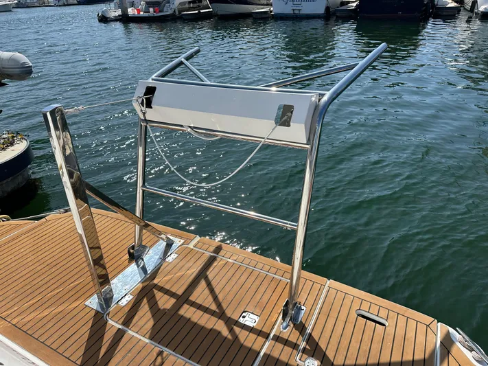 No Dploma Yacht Photos Pics 2009 Cruisers Yachts 420 Express swim platform with stainless steel ladder, docked in marina.