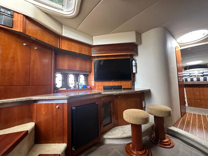 No Dploma Yacht Photos Pics Luxurious 2009 Cruisers Yachts 420 Express interior with wood cabinetry and modern amenities.