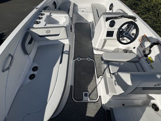 2023 Hurricane SunDeck Sport 205 OB interior with seating, steering wheel, and cup holders.