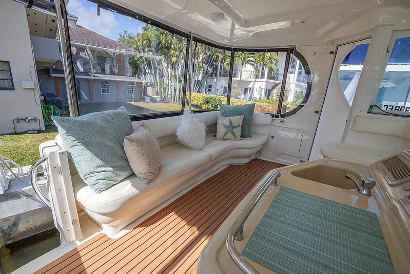 Pure Drive Yacht Photos Pics 2005 Sea Ray 390 Motor Yacht interior with plush seating and elegant wood flooring.