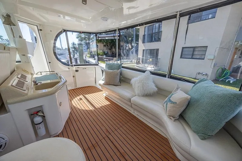 Pure Drive Yacht Photos Pics 2005 Sea Ray 390 Motor Yacht interior with plush seating and elegant wood flooring.