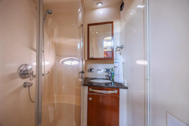 Pure Drive Yacht Photos Pics 2005 Sea Ray 390 Motor Yacht bathroom with shower, sink, and mirror.