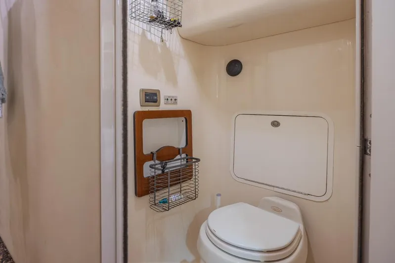 Pure Drive Yacht Photos Pics 2005 Sea Ray 390 Motor Yacht bathroom with toilet and storage features.